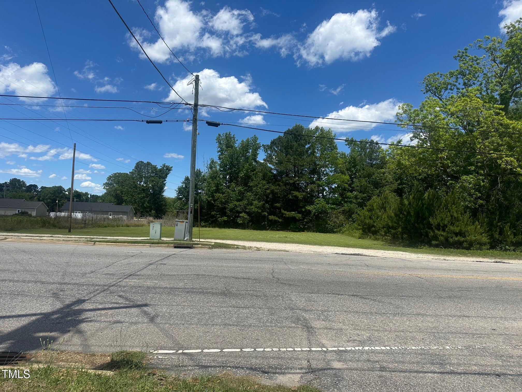0 Denim Drive Erwin, NC 28339 - Photo 2 of 4 a view of a swimming pool with an outdoor space and seating area
