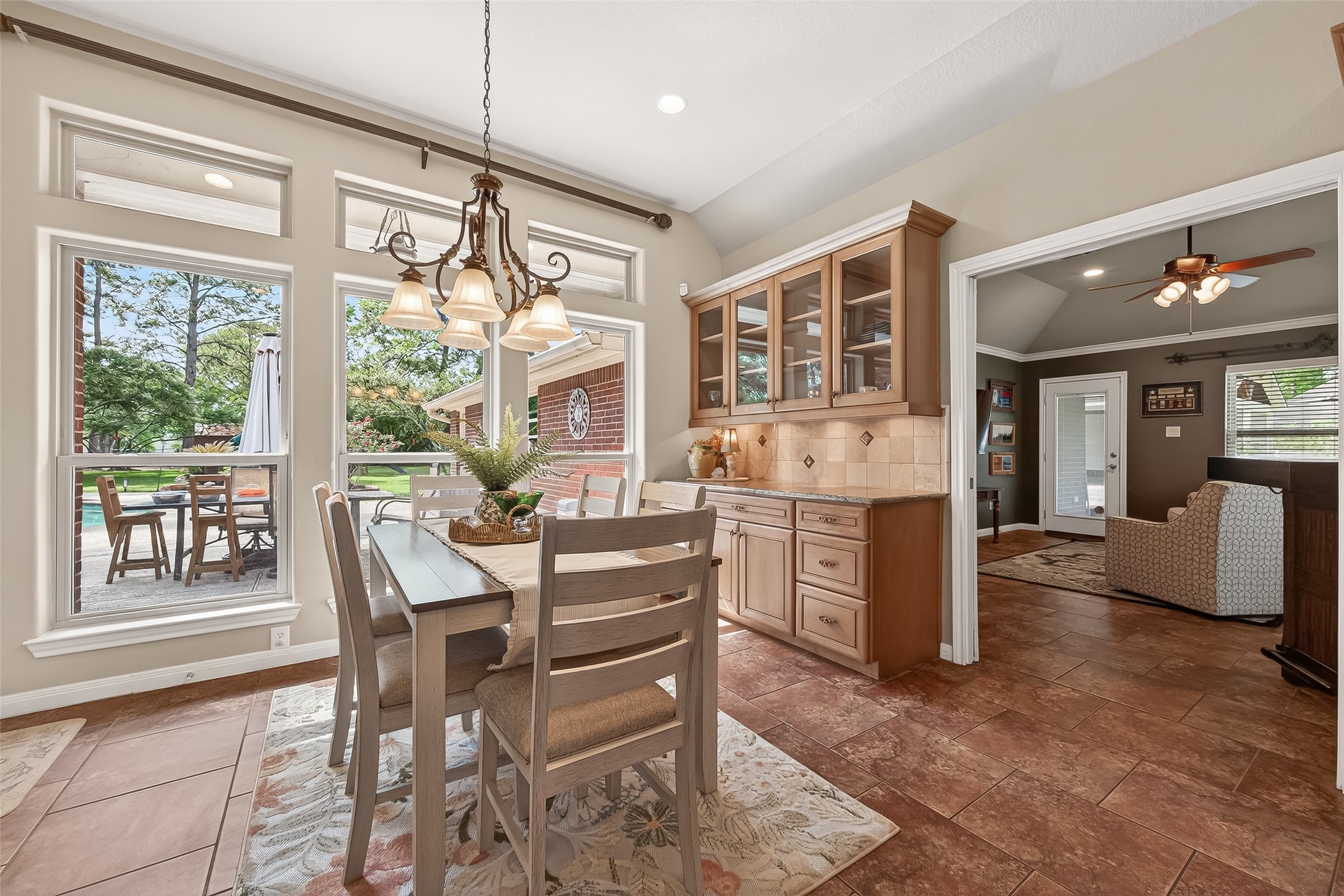 17603 Bending Cypress Road Cypress, TX 77429 - Photo 17 of 43 A bright breakfast dining area with large windows overlooking a patio and garden.