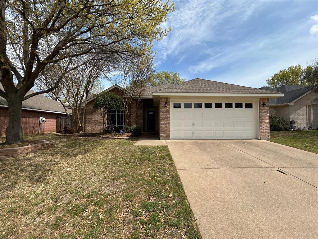 7336 Bennington Drive Watauga, TX 76148 - Photo 1 of 1 Single story home with a front lawn, driveway, a garage, and brick siding