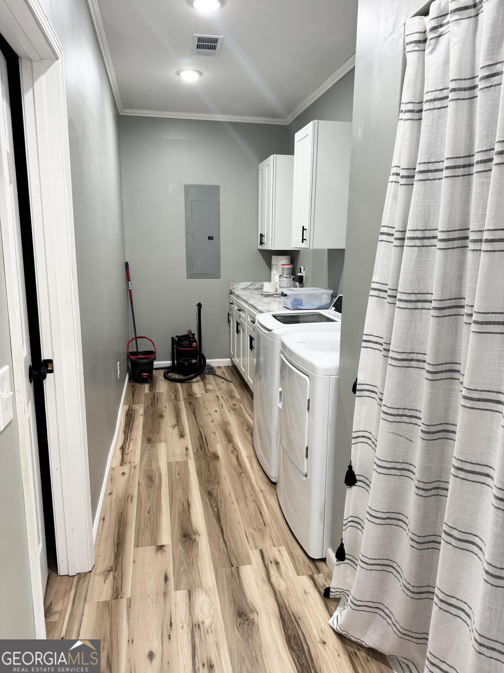 210 St Galilee Road Swainsboro, GA 30401 - Photo 12 of 18 a kitchen with sink a refrigerator and cabinets