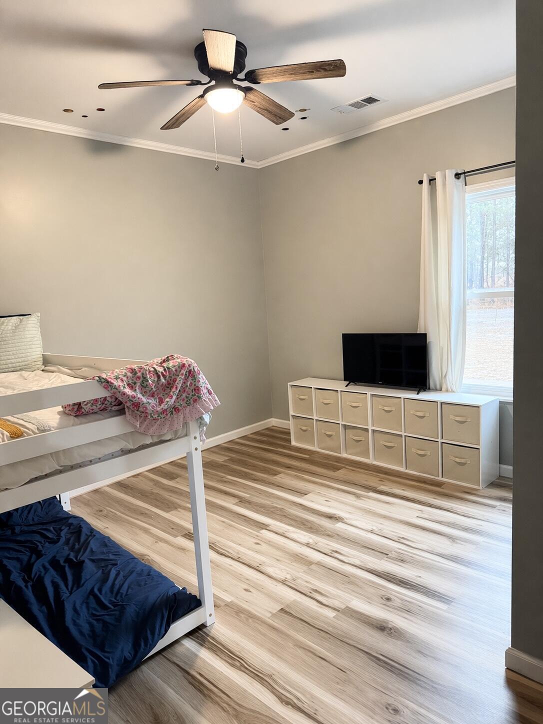 210 St Galilee Road Swainsboro, GA 30401 - Photo 13 of 18 a bedroom with a bed and walk in closet