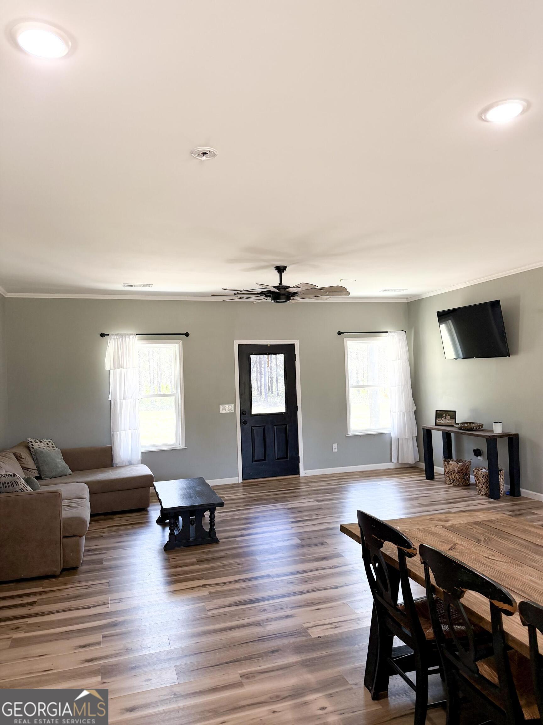 210 St Galilee Road Swainsboro, GA 30401 - Photo 6 of 18 a living room with furniture and wooden floor