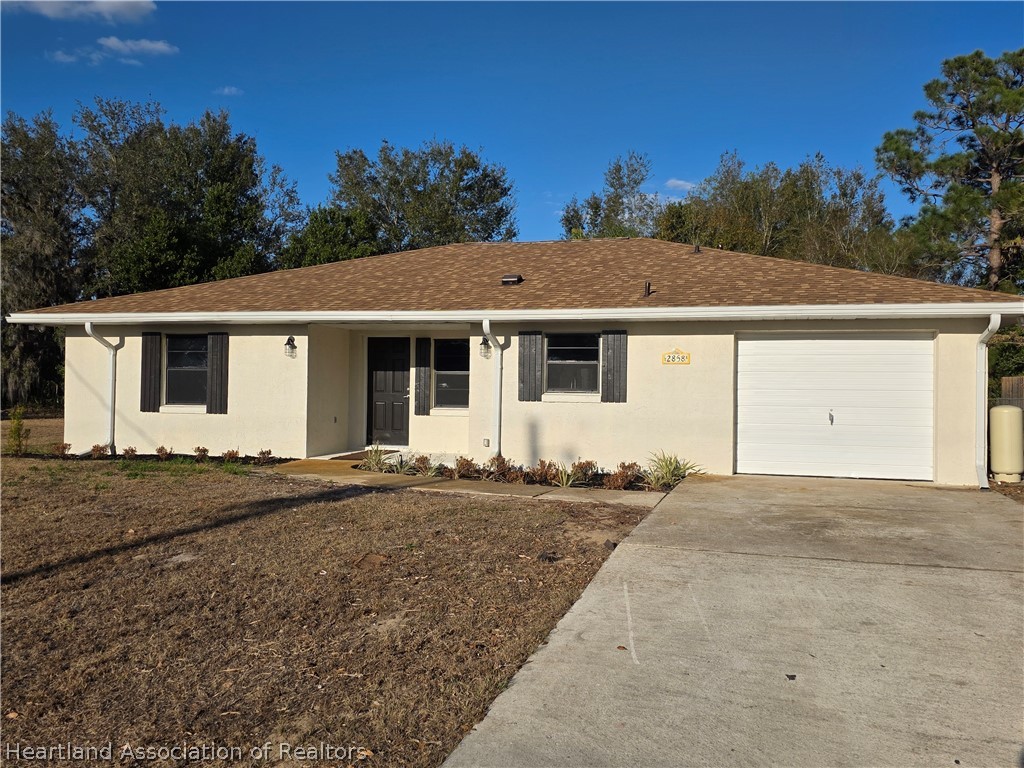 2858 North Lancaster Road Avon Park, FL 33825 - Photo 1 of 13 a view of a house with backyard