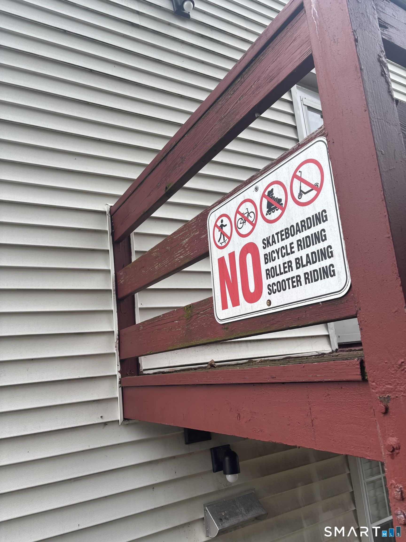 74 Standish Road, Unit 3 Stamford, CT 06902 - Photo 6 of 22 a sign that is on a wooden wall