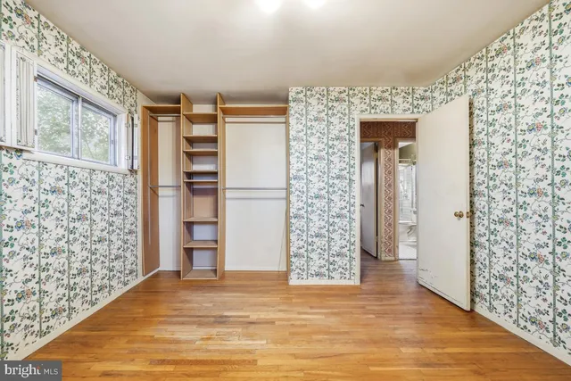 a view of empty room with wall and window