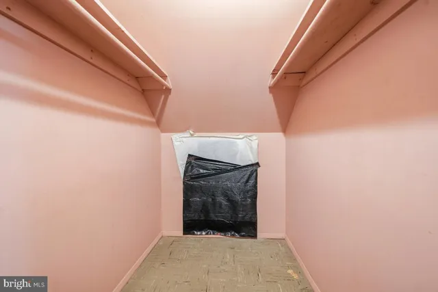 a view of a room with wooden walls