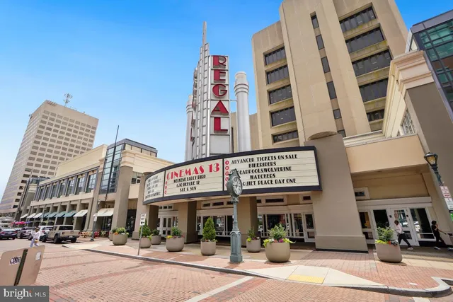 a view of a street with a potted plants