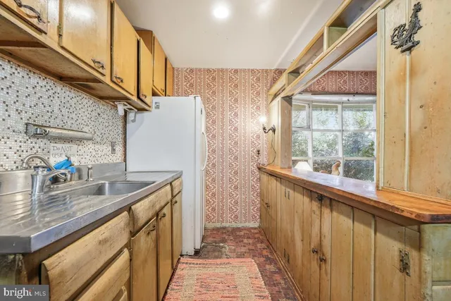 a kitchen with a sink and a window