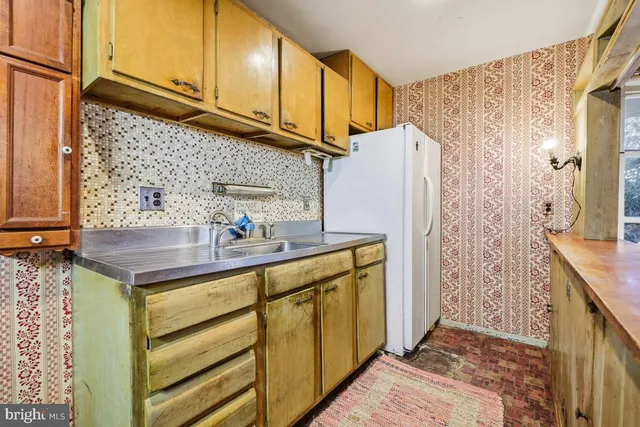 a bathroom with a sink a mirror and shower