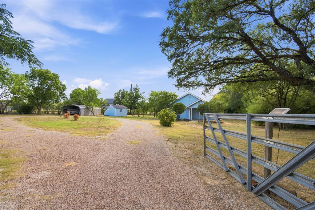 3325 Dove Creek Road Cleburne, TX 76031 - Photo 21 of 40 Gravel driveway leading to multiple structures