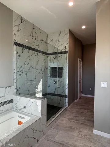 a bathroom with a bathtub and a sink