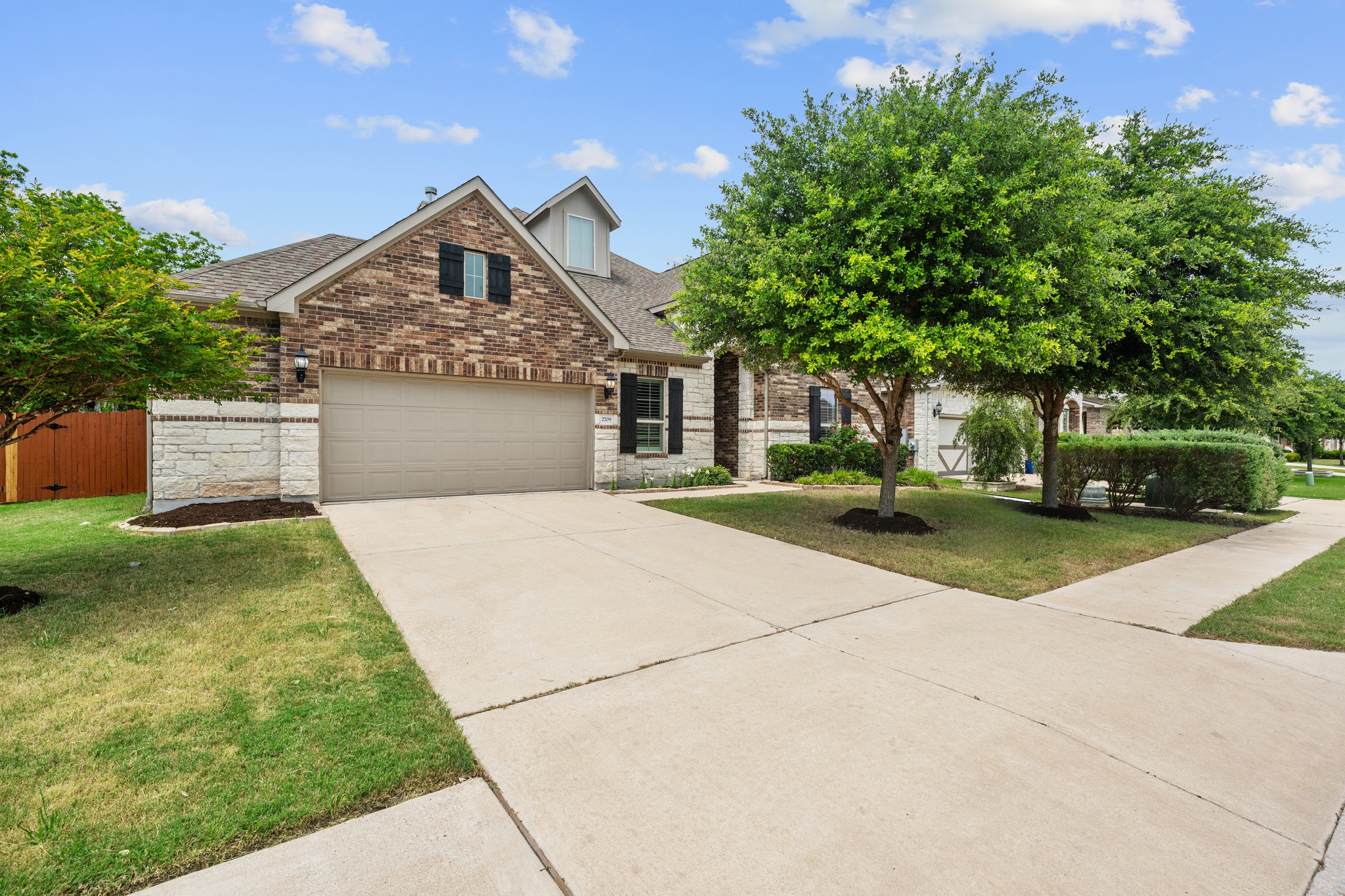 2709 Steece Way Leander, TX 78641 - Photo 1 of 39 a front view of a house with a garden