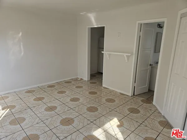 a kitchen with refrigerator and stove