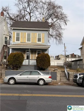 a view of a car parked in front of a houses