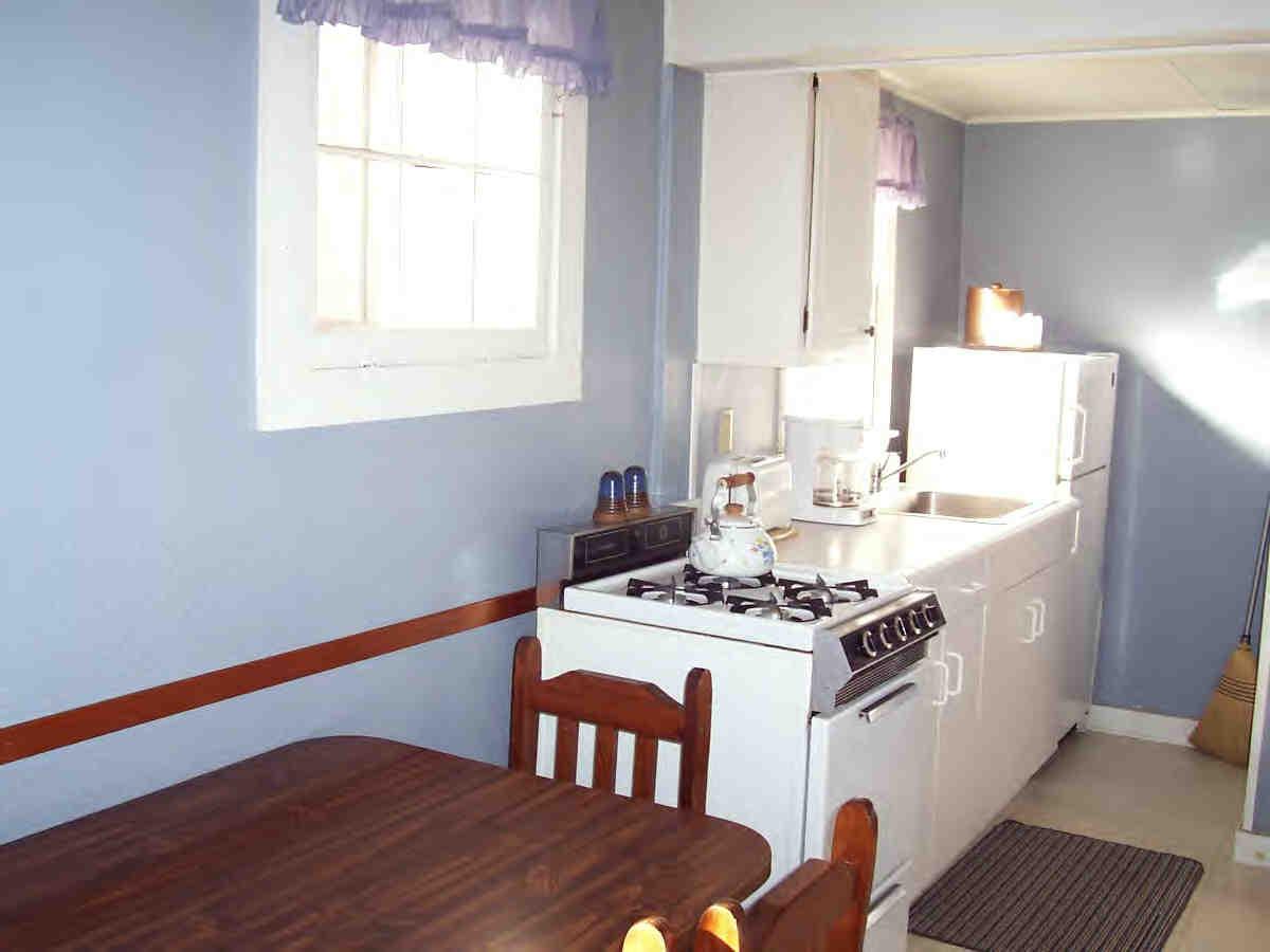 2451-4 Hancock Road Hancock, MA 01237 - Photo 3 of 6 a kitchen with stainless steel appliances kitchen island granite countertop a stove a sink and a microwave