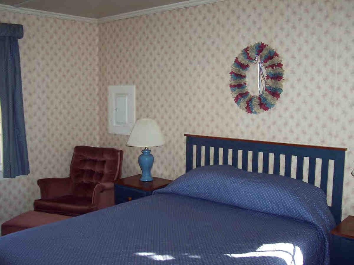 2451-4 Hancock Road Hancock, MA 01237 - Photo 4 of 6 a bedroom with two beds and a chair