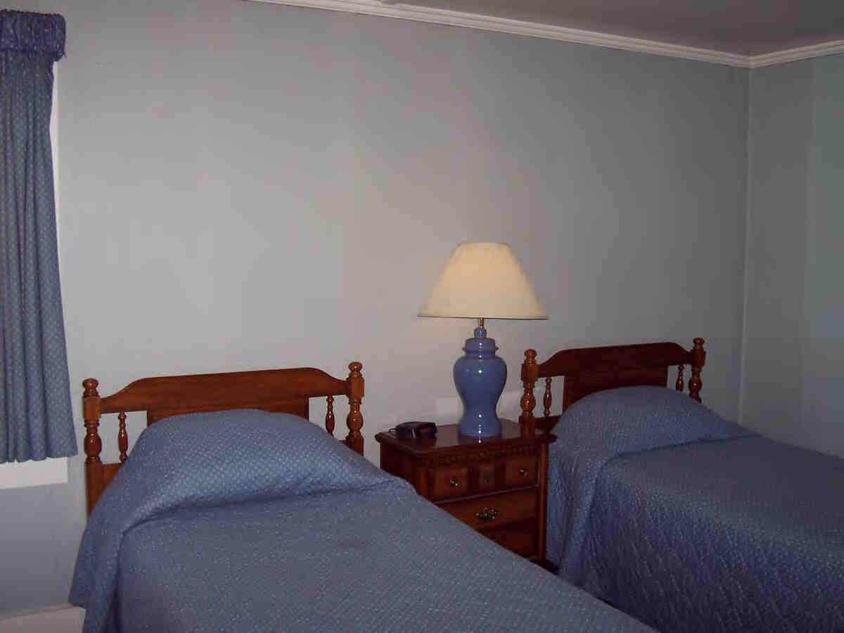 2451-4 Hancock Road Hancock, MA 01237 - Photo 6 of 6 a bed room with two bed and a lamp on dresser
