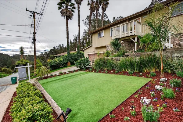 a house view with a garden space