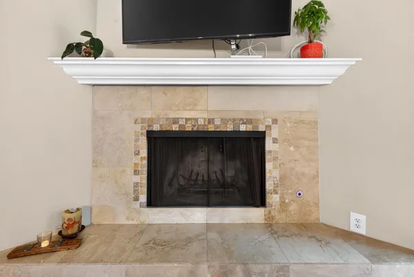 a view of living room with a fireplace