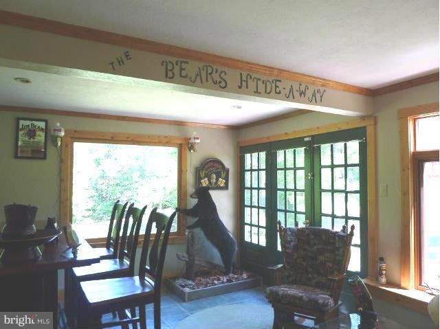 265 Riding Chapel Road Stephens City, VA 22655 - Photo 12 of 24 Sunroom and Bar Area