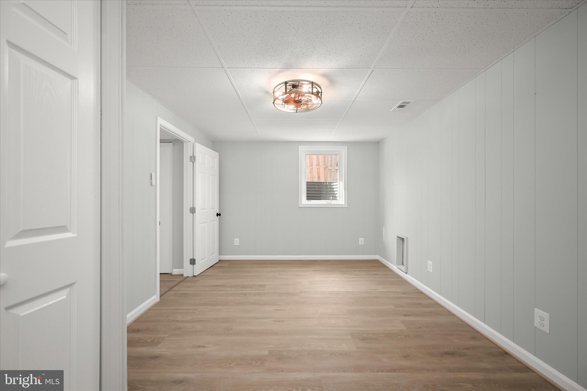 9720 Hedin Drive Silver Spring, MD 20903 - Photo 65 of 79 wooden floor in an empty room with a window