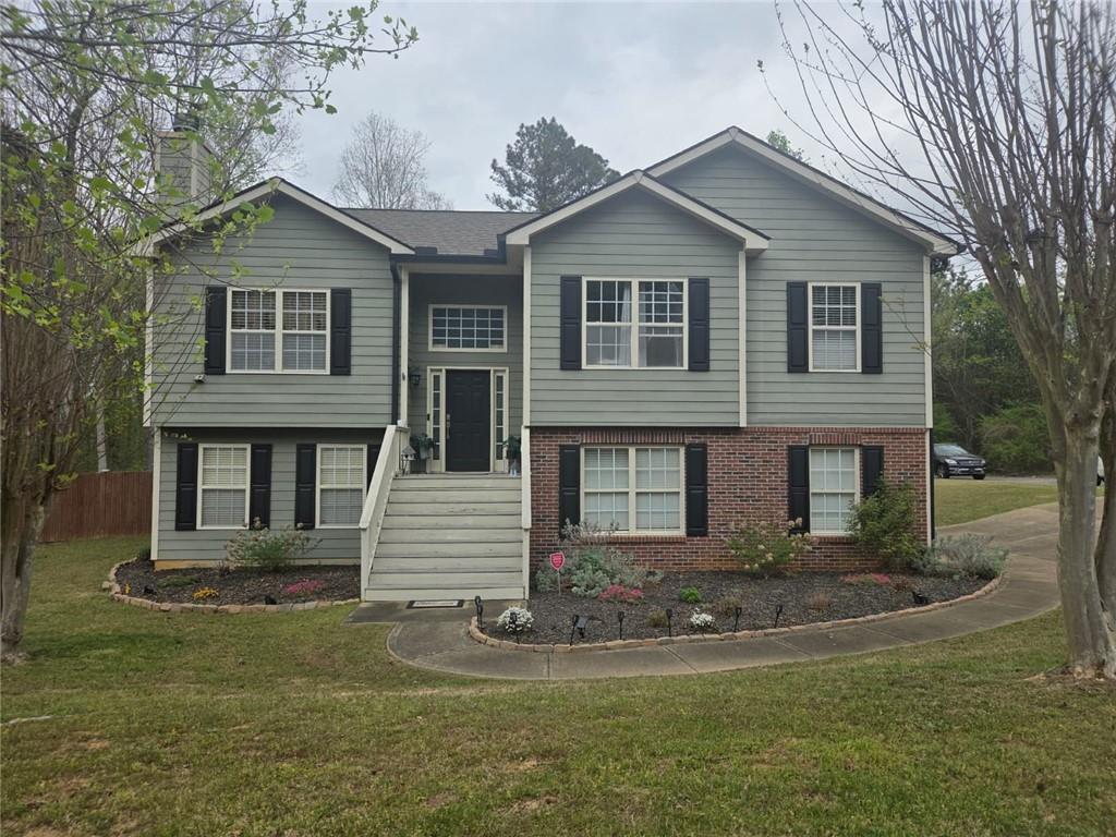 42 Highlander Trail Southwest Rome, GA 30165 - Photo 15 of 15 a front view of a house with a yard