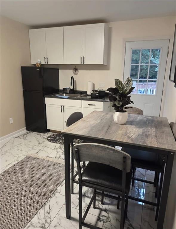 42 Highlander Trail Southwest Rome, GA 30165 - Photo 10 of 15 a kitchen with a table chairs and cabinets