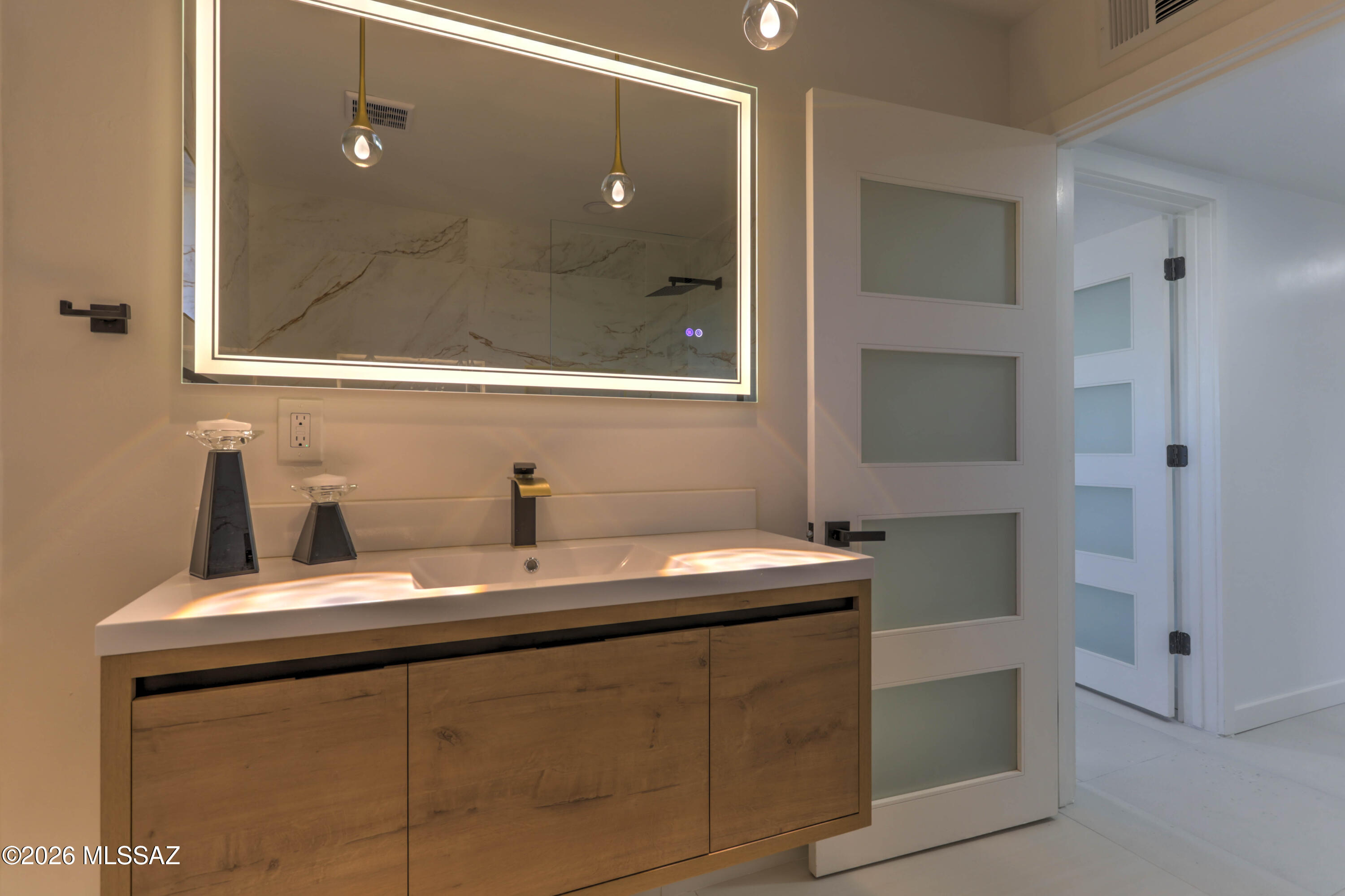 4939 East River Road Tucson, AZ 85718 - Photo 11 of 29 a bathroom with a sink and a mirror