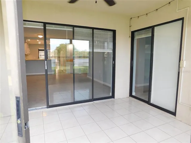 a view of a glass door and an empty room