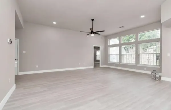 a view of an empty room with a window