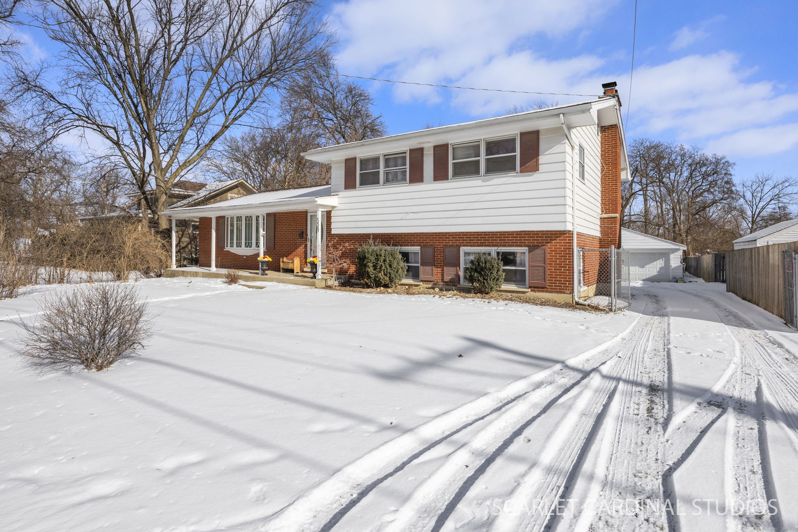 509 South Westmore-Meyers Road Lombard, IL 60148 - Photo 2 of 23 a view of a white house with a large tree