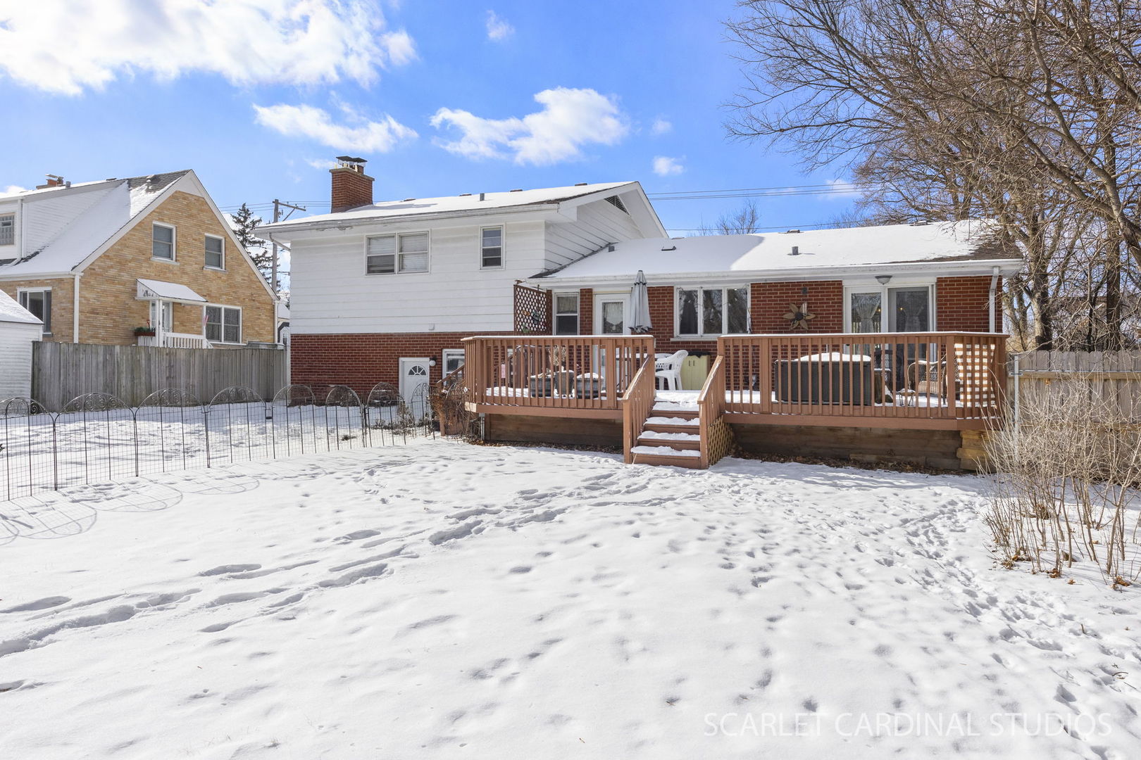 509 South Westmore-Meyers Road Lombard, IL 60148 - Photo 22 of 23 a front view of a house with a yard covered in snow
