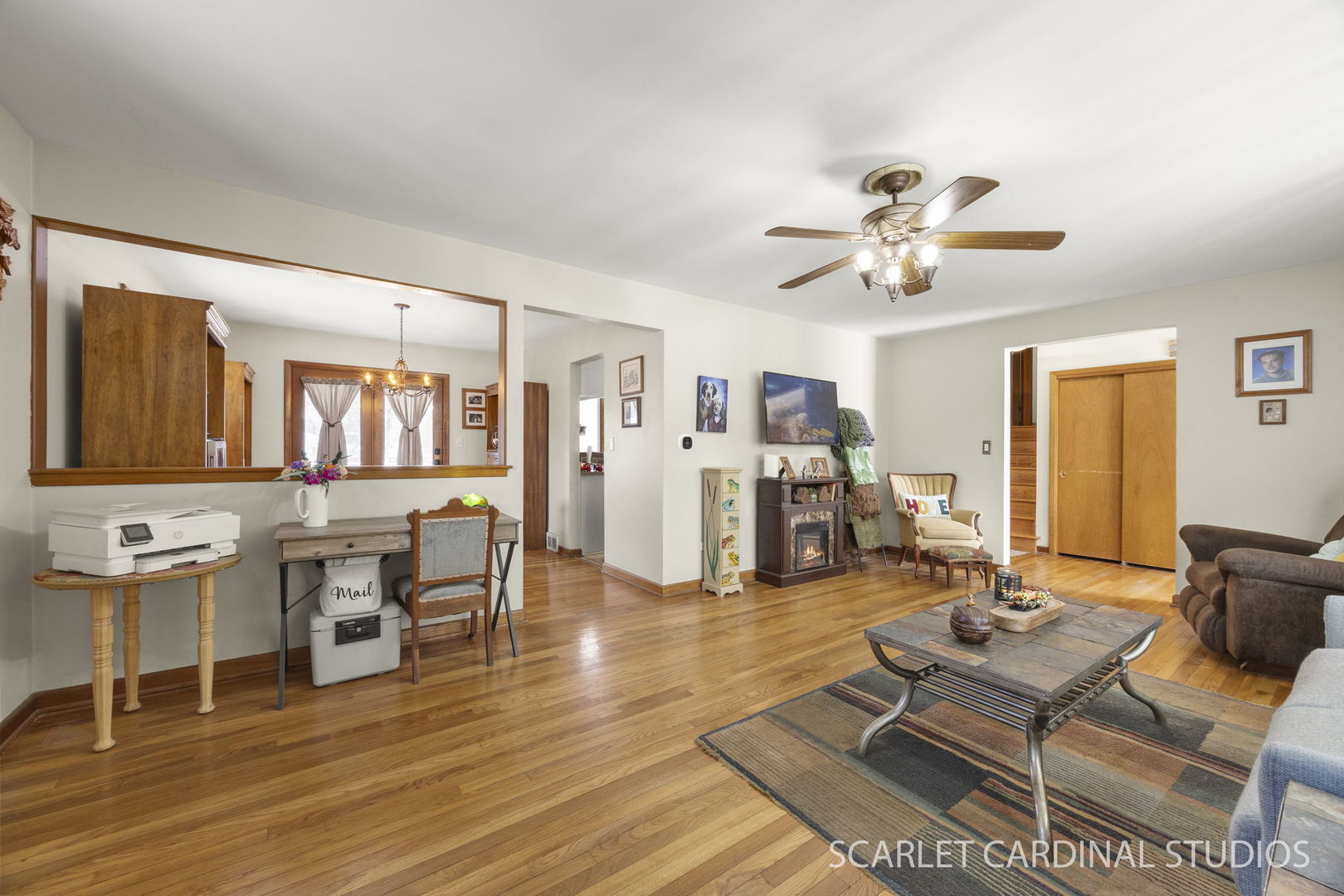 509 South Westmore-Meyers Road Lombard, IL 60148 - Photo 6 of 23 a living room with furniture a wooden floor and a chandelier