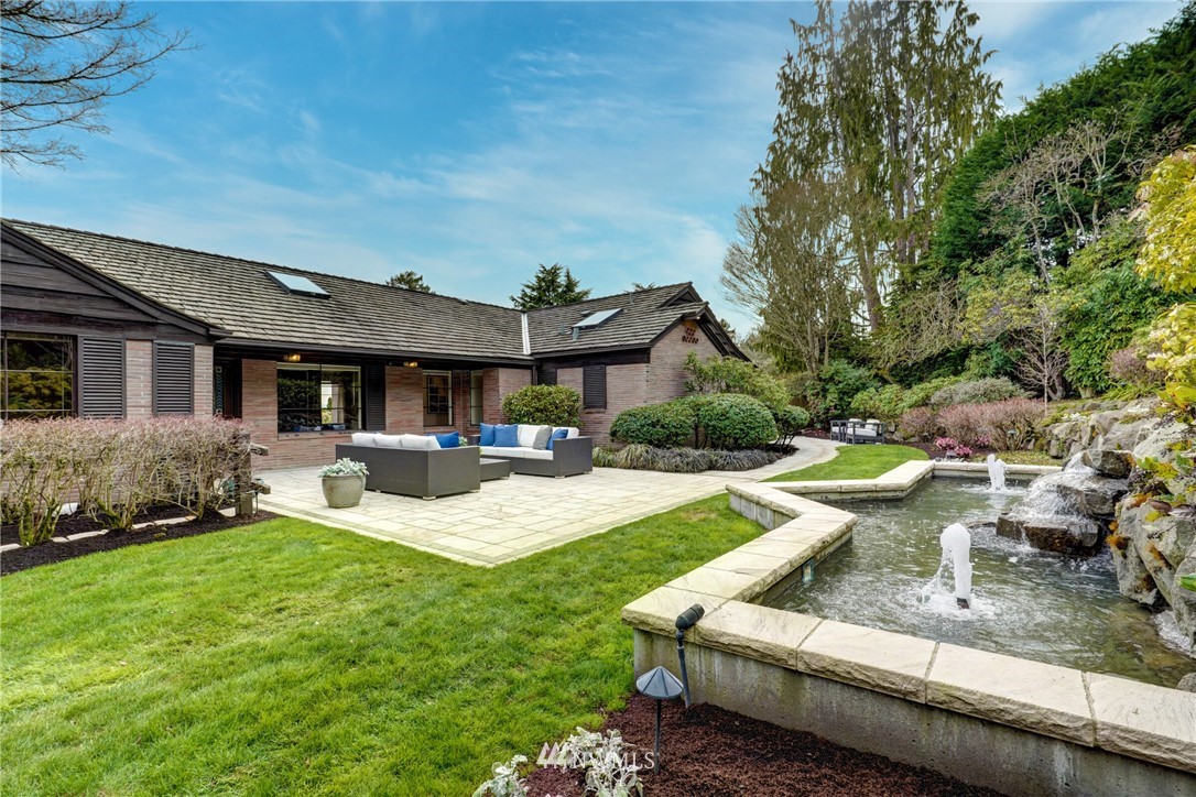 6410 Northeast Windermere Road Seattle, WA 98105 - Photo 20 of 40 a view of a house with backyard sitting area and swimming pool