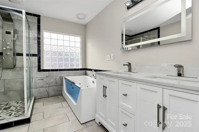 a bathroom with a bathtub and shower