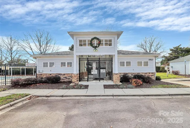 a view of a swimming pool with an outdoor seating and a yard