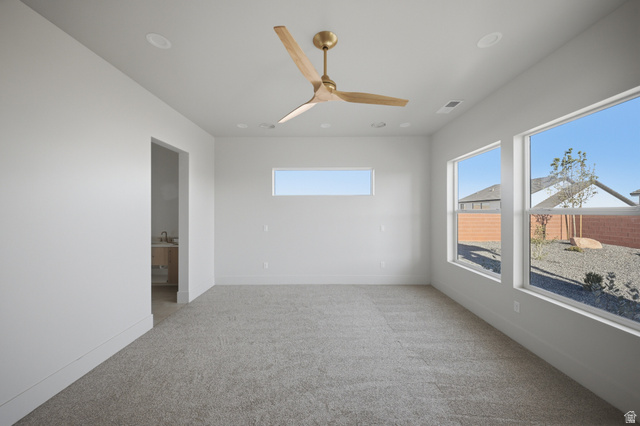 3011 East Rimrunner Drive, Unit 302 St. George, UT 84790 - Photo 20 of 45 Empty room featuring light carpet and a ceiling fan