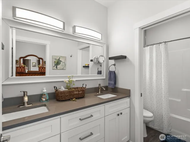 a bathroom with sinks and a mirror