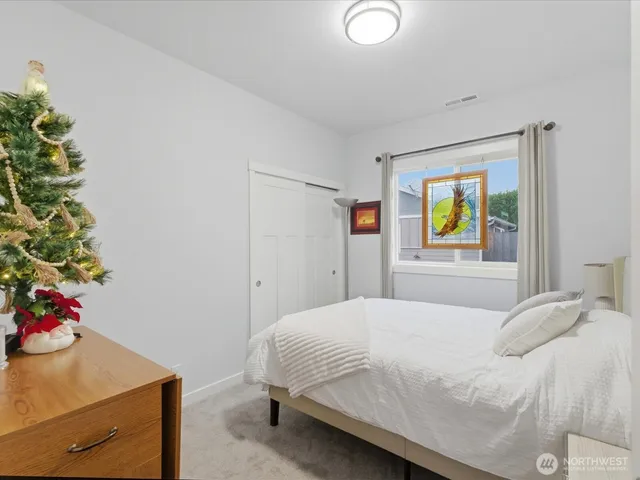 a bedroom with a bed and a view of bathroom