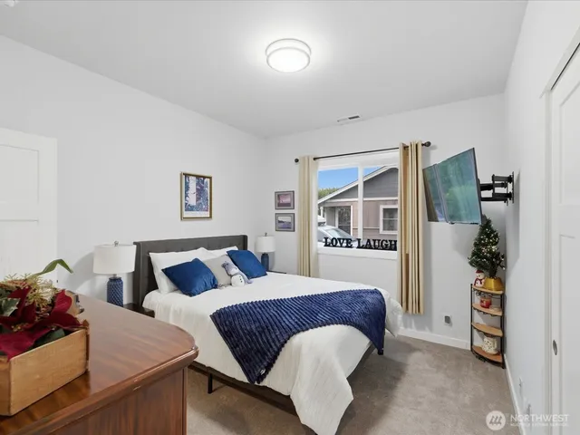 a bathroom with a sink a toilet and shower curtain