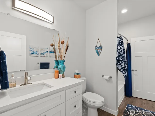 a bathroom with a bathtub and shower