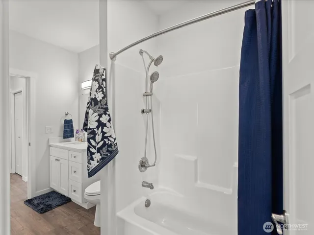 a bathroom with double vanity sink and a mirror