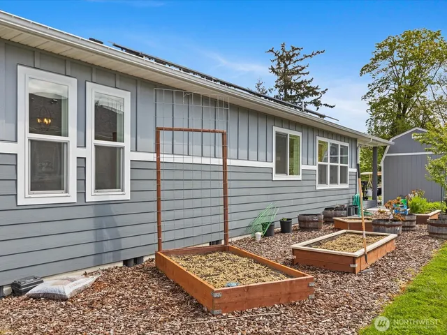 an outdoor space with furniture and garden
