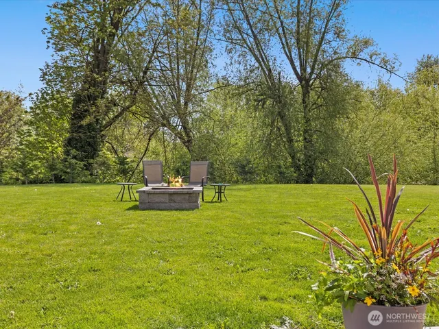 an aerial view of a swimming pool patio and lake view