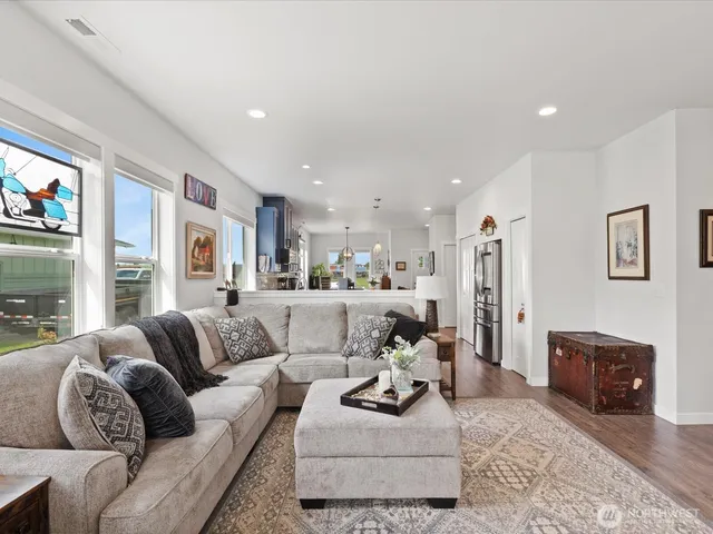a living room with furniture potted plant and a fireplace