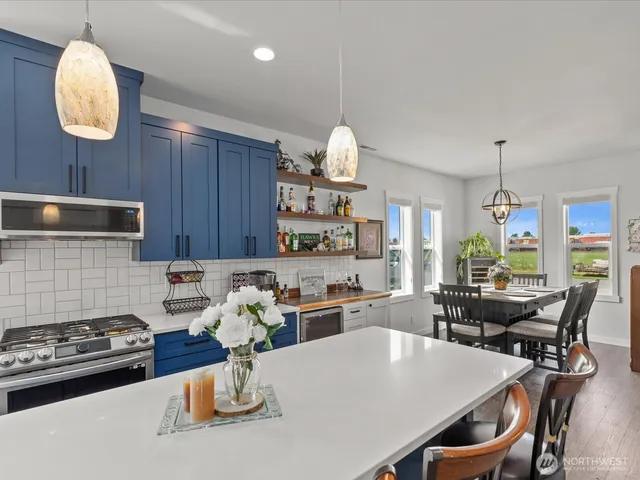 a kitchen with a dining table and chairs