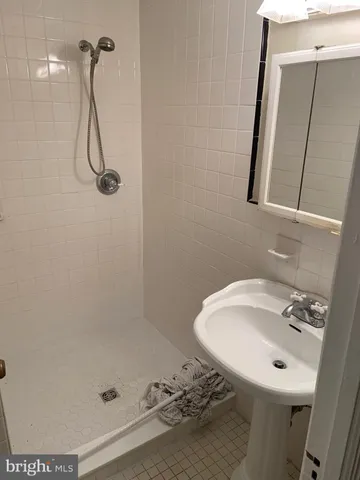 a bathroom with a sink and mirror