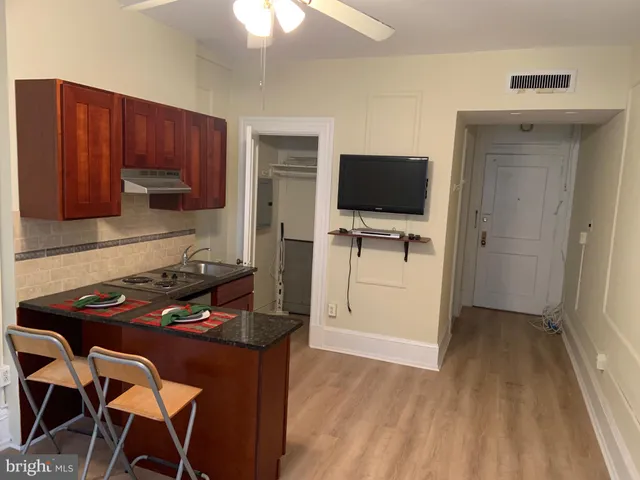 a kitchen with a table and chairs in it