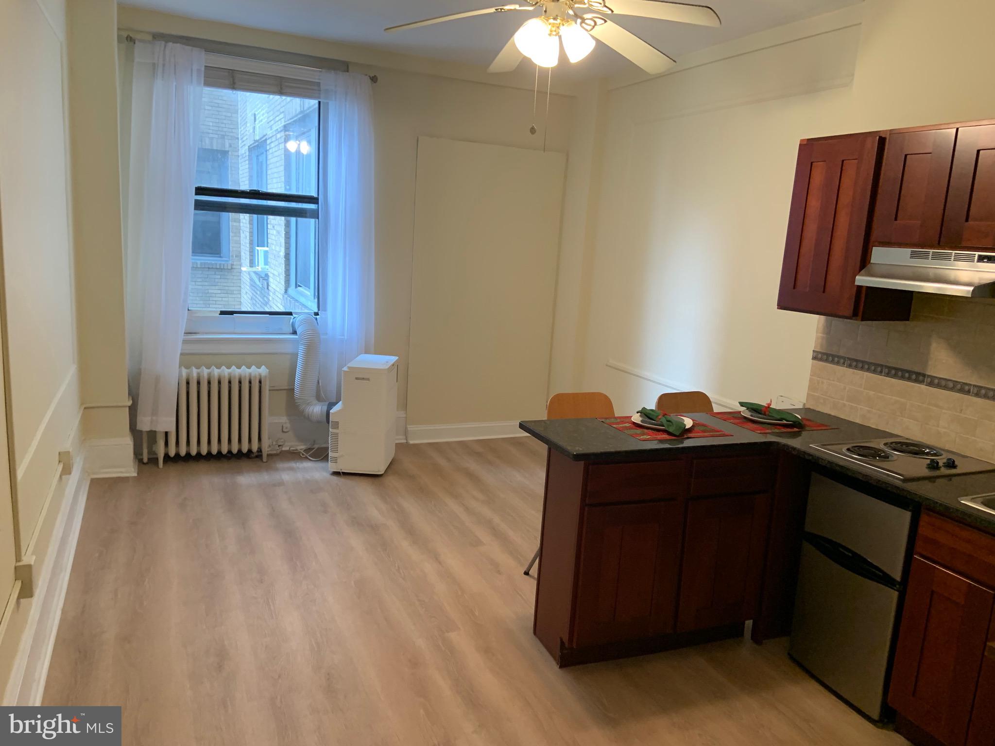 1324 Locust Street, Unit 901 Philadelphia, PA 19107 - Photo 5 of 5 a room with a bed and a window