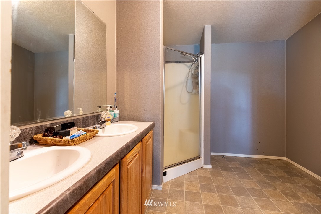 176 Nelson Road Winlock, WA 98596 - Photo 11 of 16 a bathroom with a sink vanity and a mirror